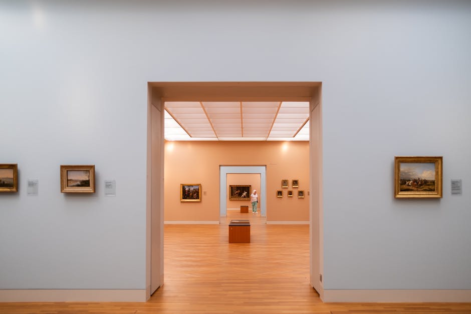 A serene museum gallery with framed artworks adorning the walls, showcasing classic paintings.