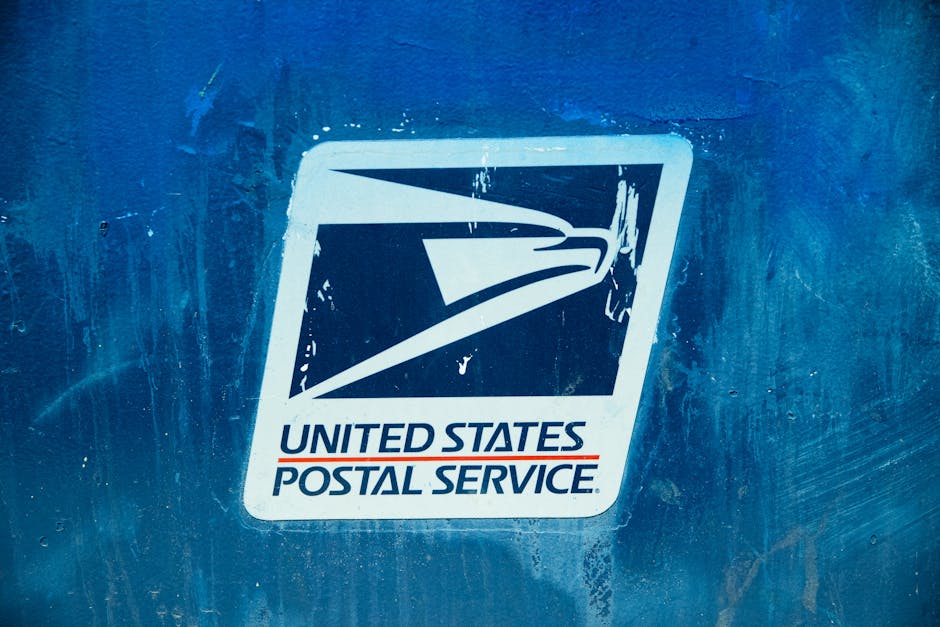 Detailed view of the United States Postal Service logo on a blue background, showcasing texture.
